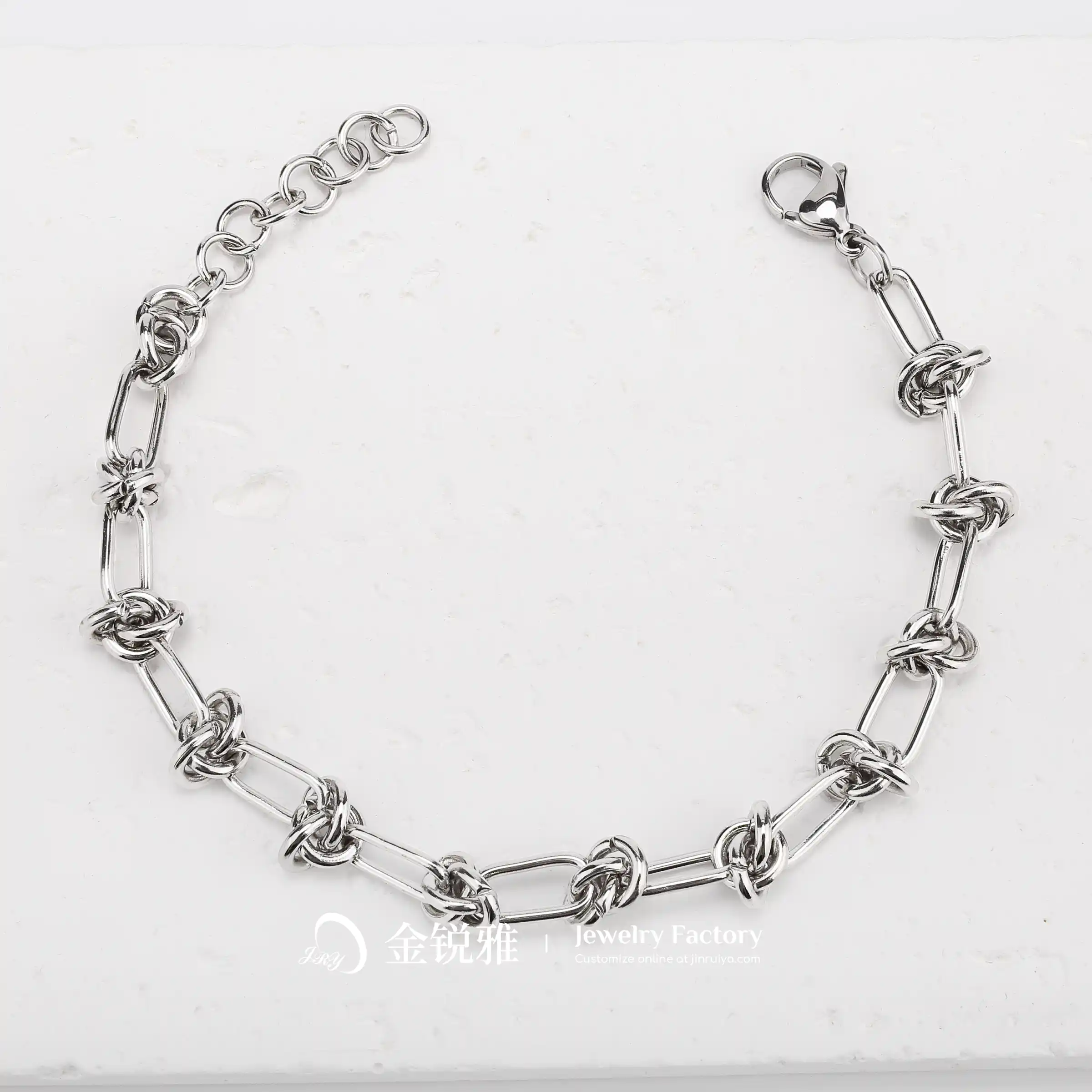 Still life shot of a steel colored stainless steel twist chain bracelet